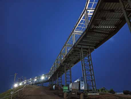 Steel conveyor bridge structure at dusk